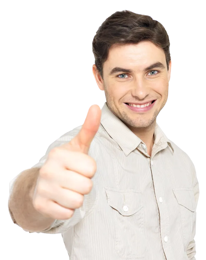 Smiling man in a light shirt giving a thumbs-up toward the camera